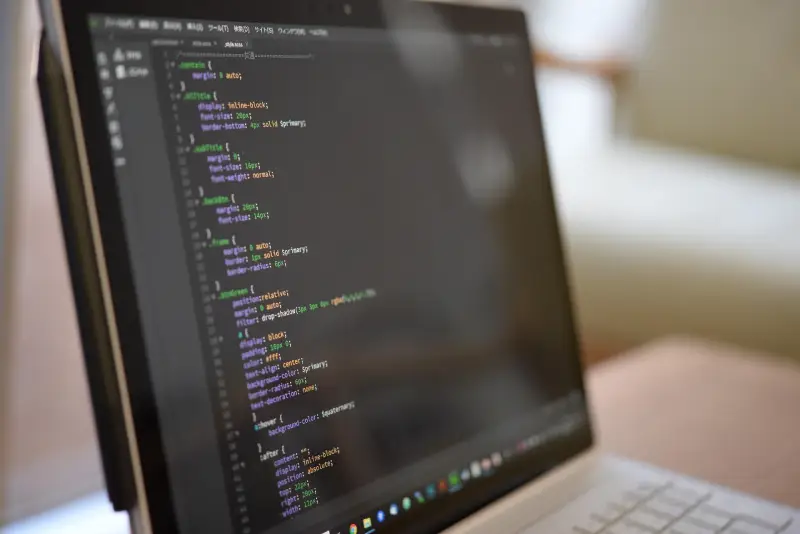 Computer with programming code showing